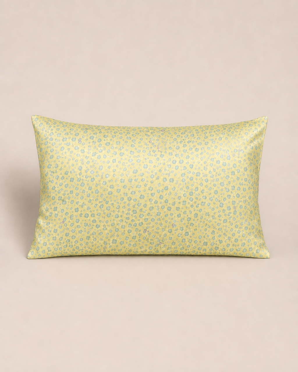 Yellow Leopard 22 momme silk front pillowcase on a warm beige studio background.