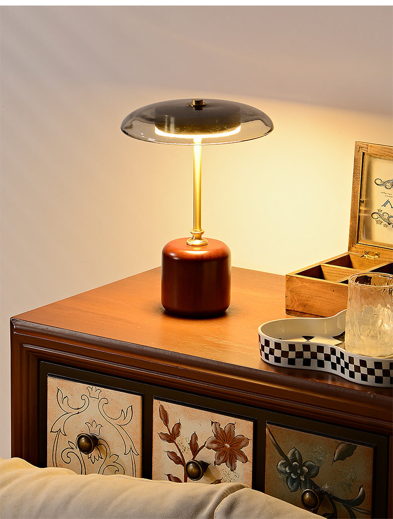 American MCM table lamp on a wooden surface with decorative elements