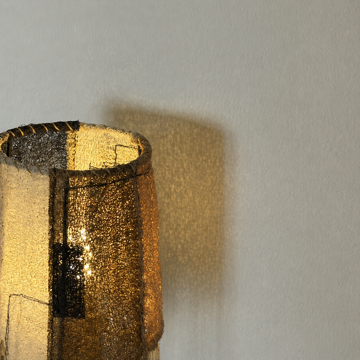 Wabi-Sabi Loofah Patchwork Table Lamp - Contrast macro detail shot revealing the fabric texture up close