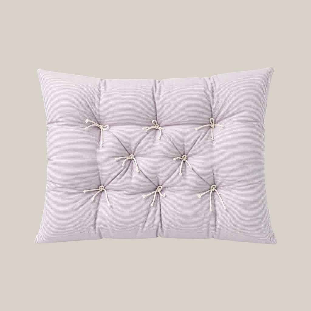 French vintage patterned pillow cushion in Pale Lavender Stripe style on a warm beige studio background.