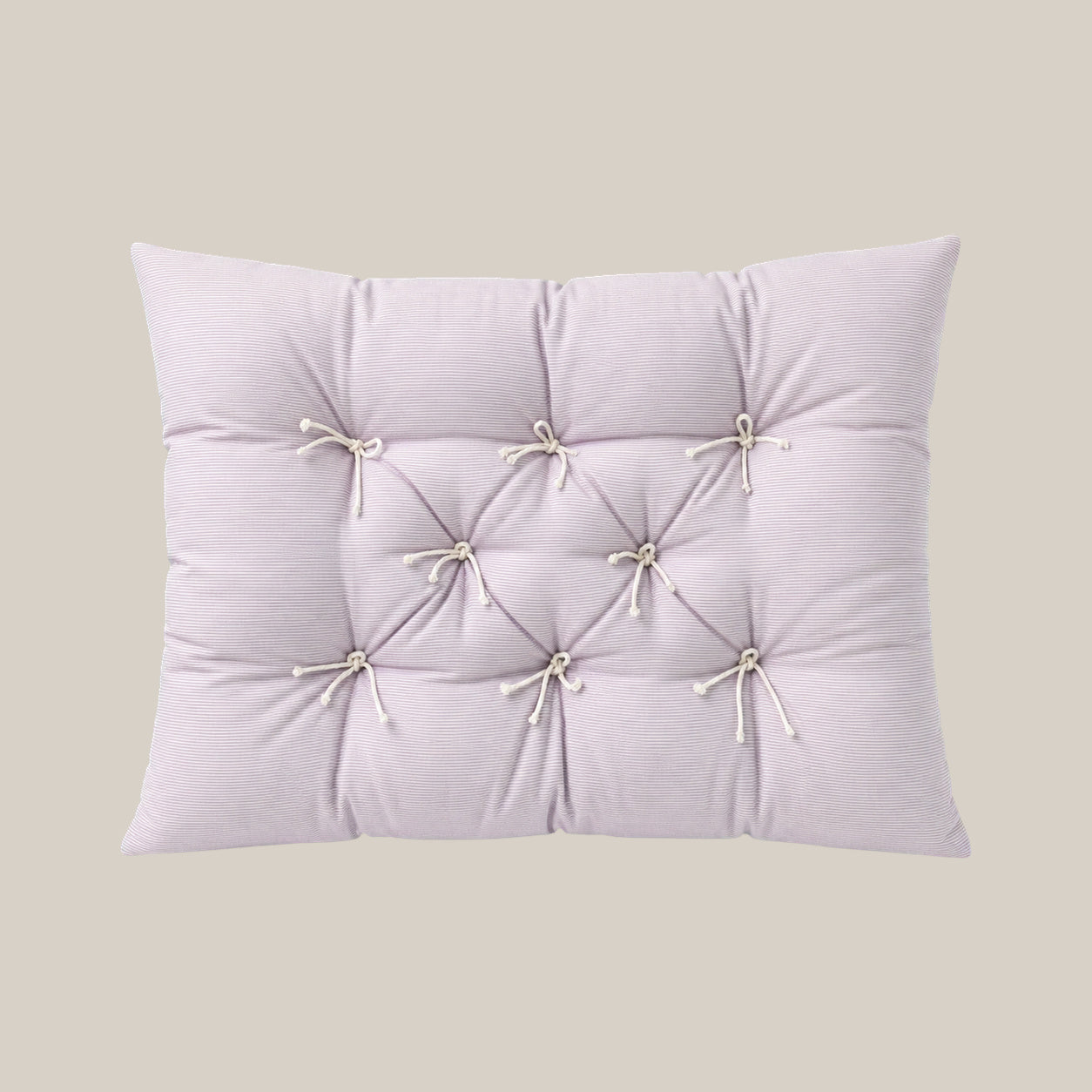 French vintage patterned pillow cushion in Pale Lavender Stripe style on a warm beige studio background.