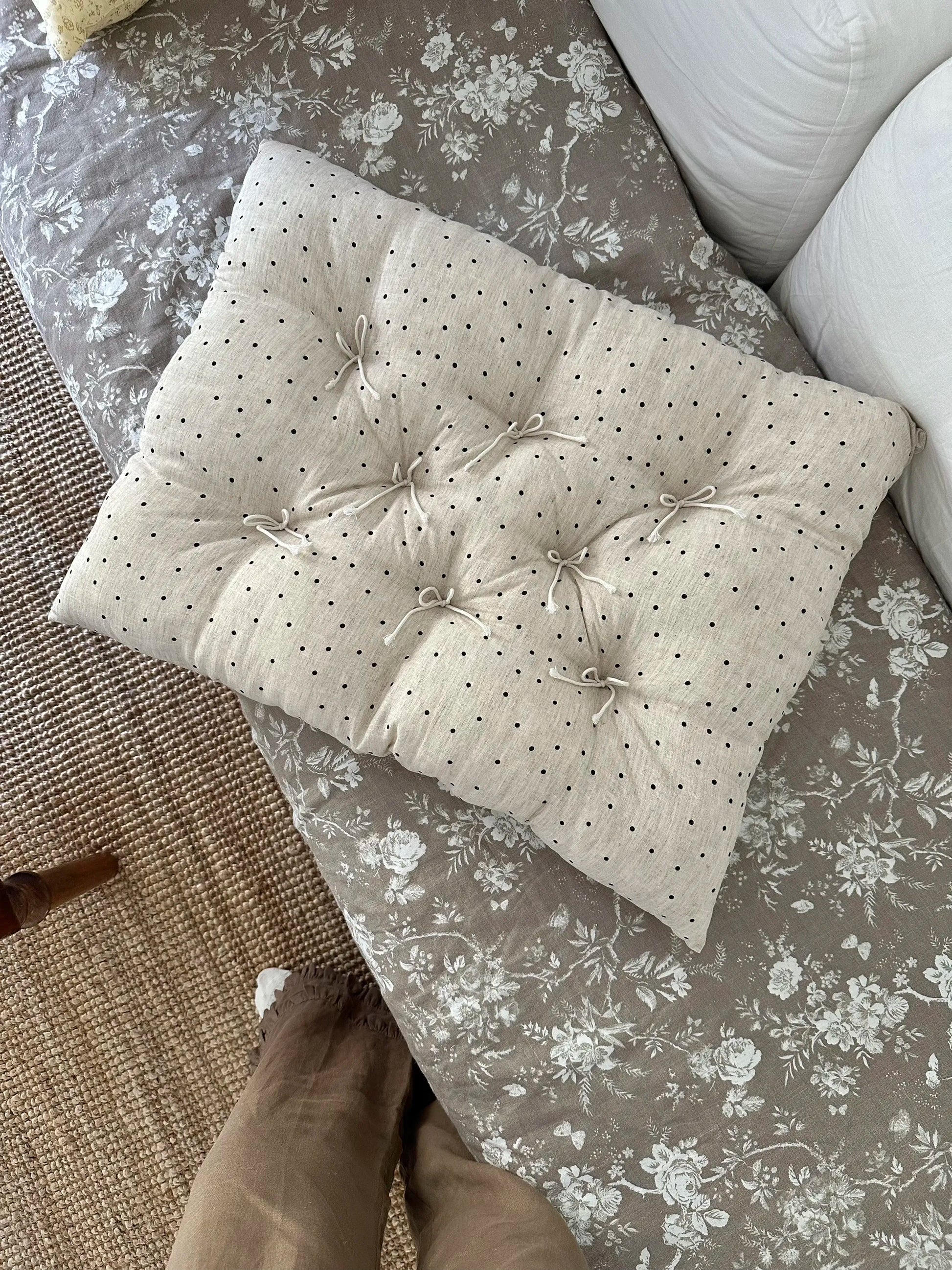 Top detail of the Polka Dot French vintage patterned pillow cushion showing tie details and quilted texture.