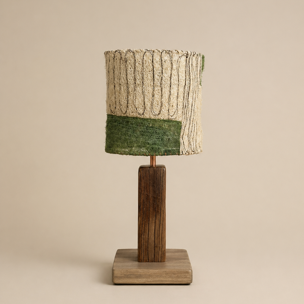 Loop loofah table lamp styled on a wooden coffee table in a calm wabi-sabi living room with natural light.