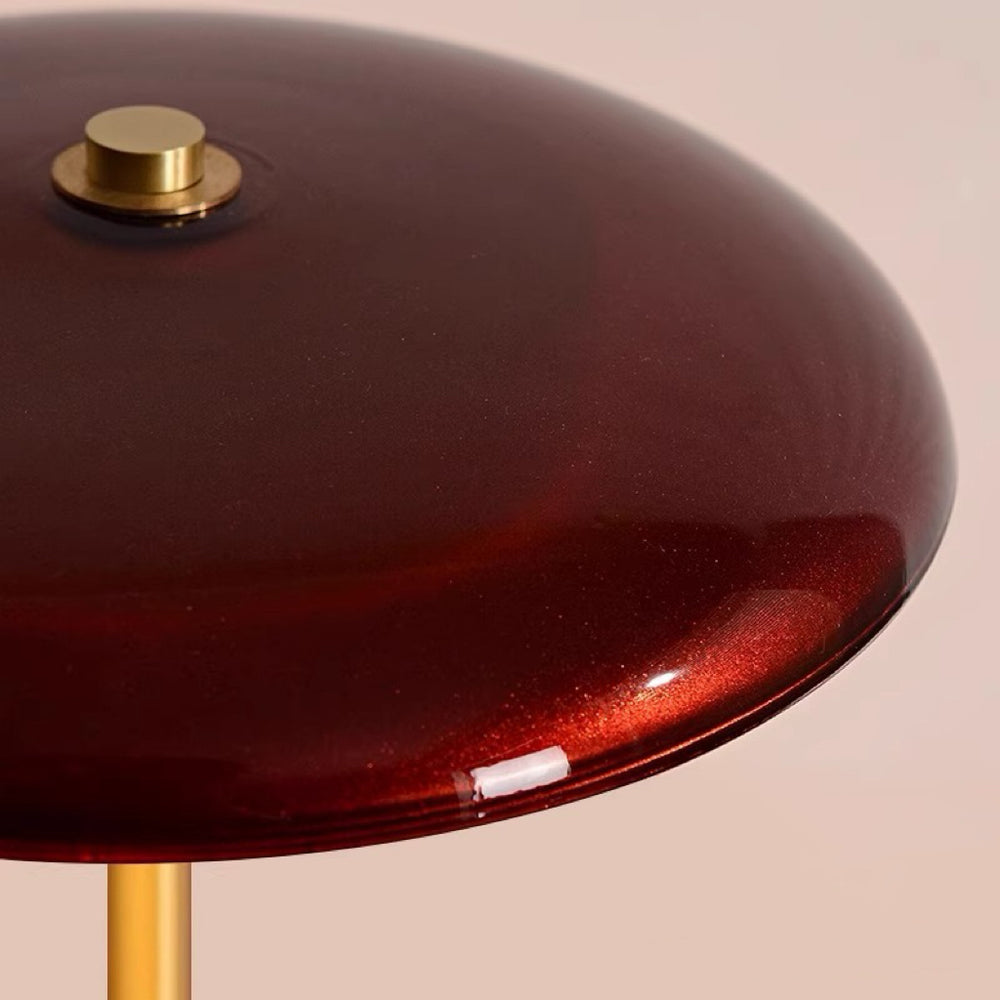 American Mid-Century Modern Table Lamp extreme close-up of the burgundy glossy glass mushroom shade top with gold finial knob