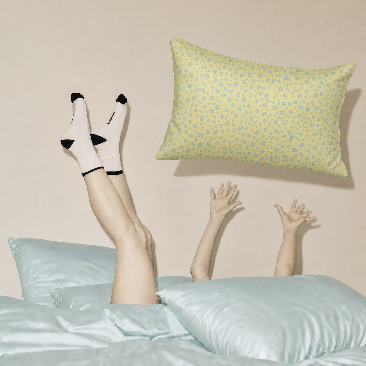 Yellow Leopard and Tiffany Blue 22 momme silk front pillowcases in a playful bedroom lifestyle scene.