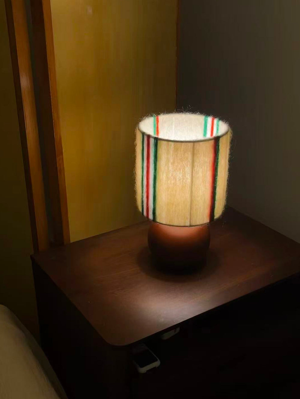 Retro Festive Mohair & Oak Wood Table Lamp glowing at night with a cozy warm ambiance perfect for evening decor