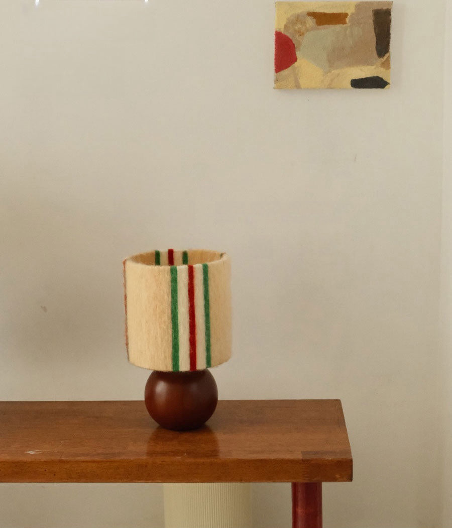 Retro Festive Mohair & Oak Wood Table Lamp feature presentation with the lamp centered as the main decor element