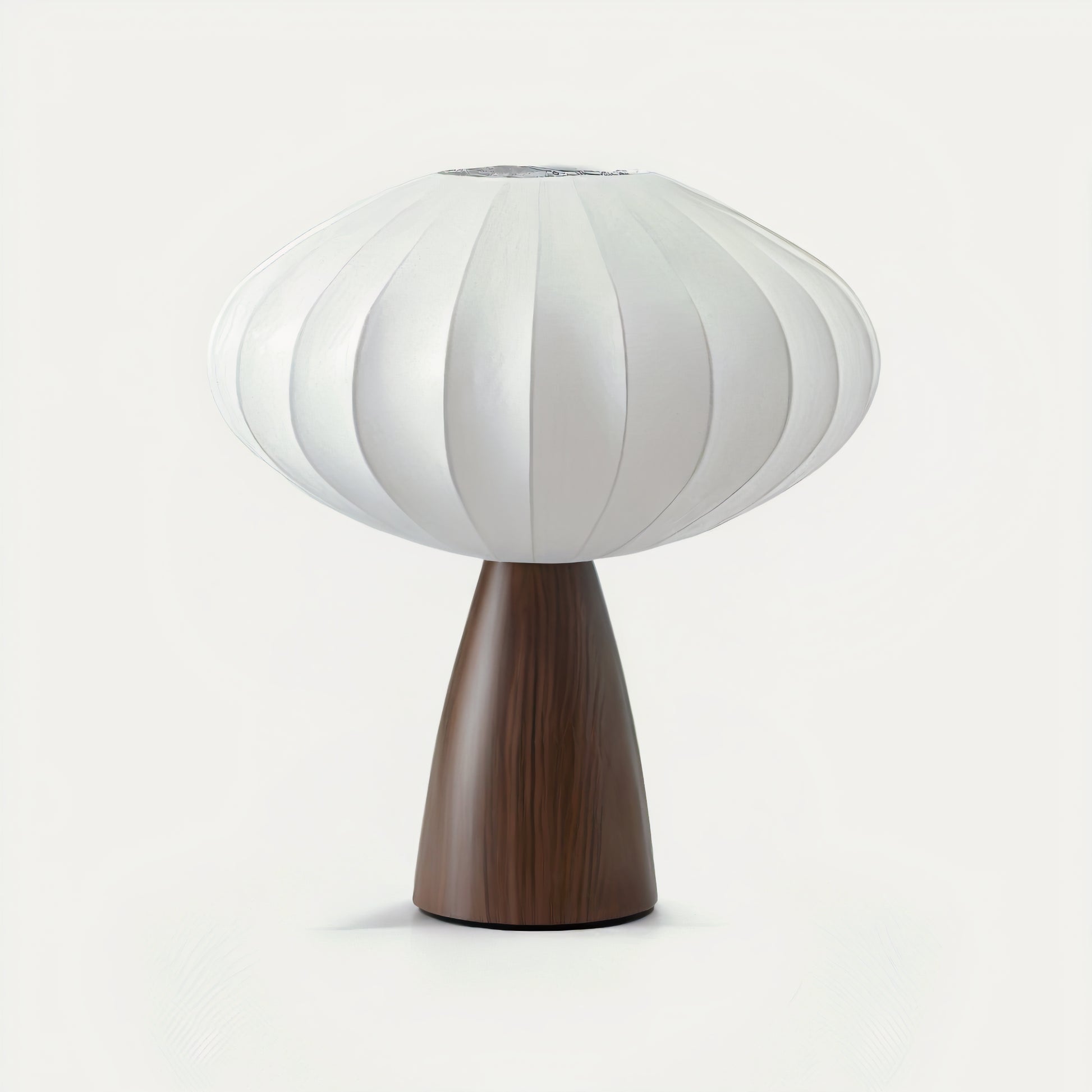 Japandi table lamp with a white ribbed shade and wooden base on a white background