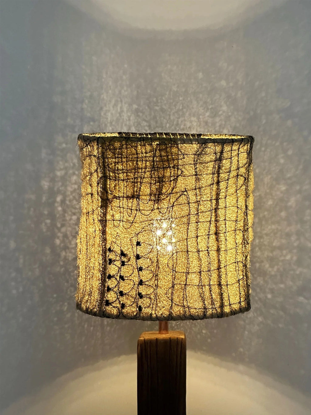 Wabi Sabi Loofah Shade Wood Table Lamp - Patch top-down view highlighting natural loofah fiber texture and sketch stitching on the shade